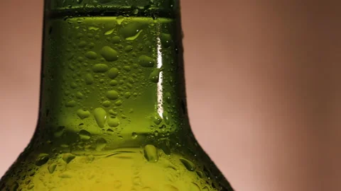 Close up shot of camera movement around beer bottle Stock Footage 144321741