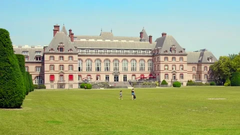 Close shot of the campus of Cité Universitaire, Paris; people loitering on Stock Footage 161772945