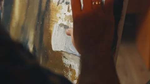 Close-up shot of the canvas has been painting by artist hand with oil paint Stock Footage 143726655