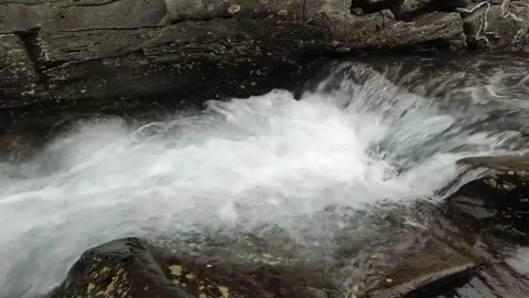 A close-up shot captures a turbulent stream Stock Footage 321997249