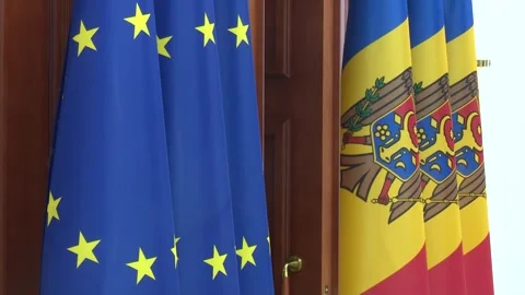 A close-up shot capturing the flags of the European Union and Moldova 動画素材 280873086
