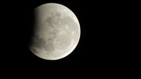 A close-up shot capturing the stunning partial lunar eclipse Stock-Footage 344355104