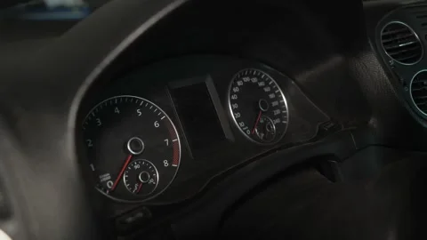 A close-up shot of a car dashboard instrument cluster panel. Stock Footage 341334674