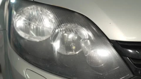 A close-up shot of a car front headlight lamp assembly. Stock Footage 341335025