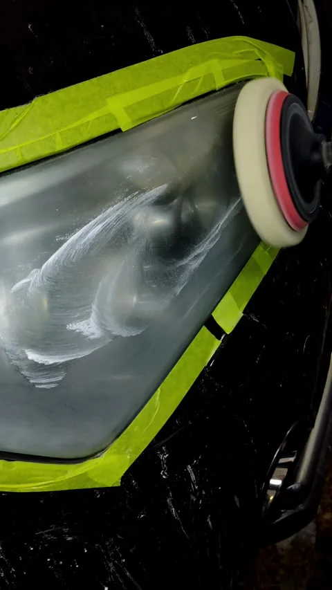 A close-up shot of a car headlight being polished Video stock 336274689