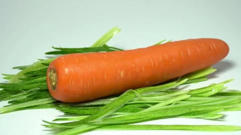 Close up shot of carrot on white background Stock Footage 186503297