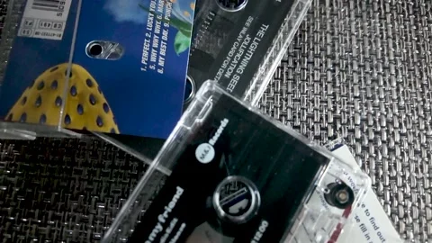 Close up shot of cassette tapes with retro music album Vintage audio cassettes Stock Footage 323085251