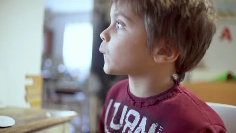 Close up shot of caucasian boy, doing distance education in front of the Stock Footage 148114680