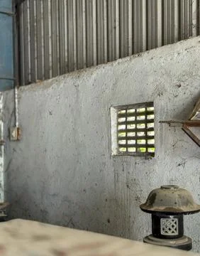 Close up shot of a cemented ventilator inside a granite factory Stock Photos