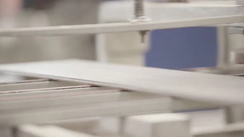 Close Shot of Ceramic Tiles Moving on Conveyer Line in a Factory Stock Footage 167128902