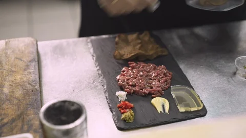 Close up shot of chef adding bread on a dish with chopped tuna 動画素材 121850955