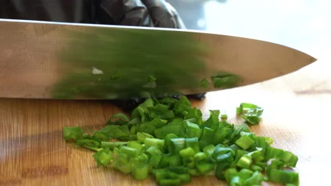 Close-up shot of chef in black gloves chopping spring or green onion, parsley Stock Footage 178551339