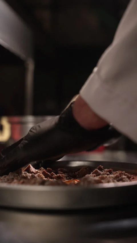 An up-close shot of a chef using tongs Stock Footage 315307763