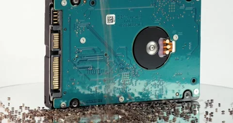 Close-up shot of chia seeds falling on a rotating table with a hdd in the middle Stock Footage 154244947