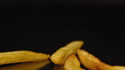 Close shot of chips falling onto a hard surface. Stock Footage 140514224