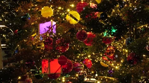 Close up shot of Christmas tree led illumination and falling snow. Video stock 249542548
