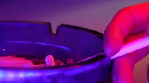 Close up shot of cigarette on table. Neo... | Stock Video