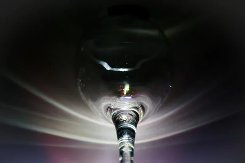 Close up shot of a class with rainbow effect on a black background Stock Illustration