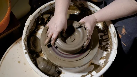 Close up shot of the clay ware, the master forms the shape of the pot on the Stock Footage 88861074