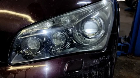 A close-up shot of a clean car headlight after detailing Stock Footage 336273148