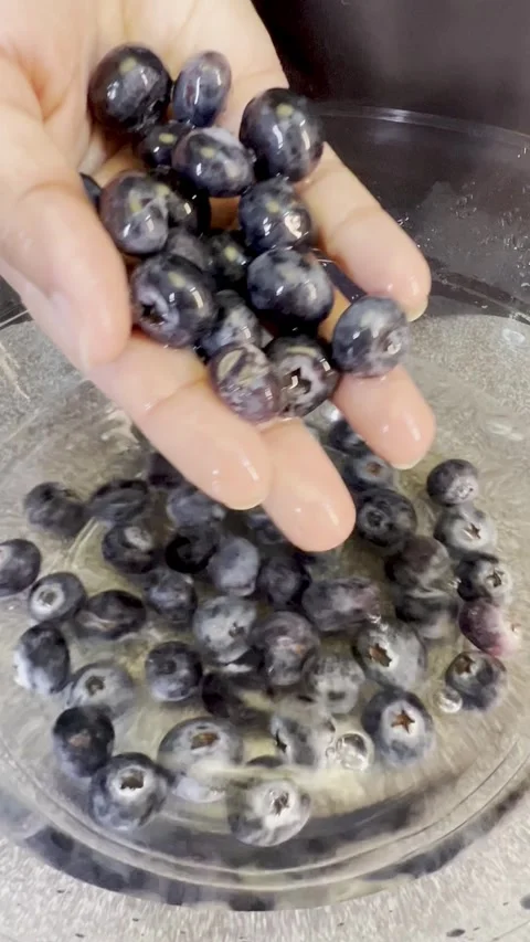Close up shot of Cleaning jamun also known as Java plum in a glass bowl. Video stock 287811271