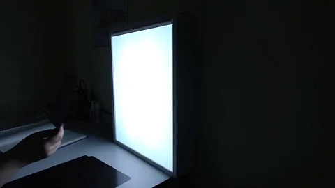 Close up shot of the clinic's doctor's hand, who examines the shot with an X-ray Stock Footage 74499729