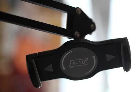 A close-up shot of a clock mounted on a wall with clear details Stock Photos