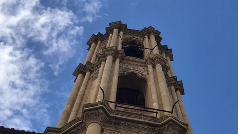 Close Up Shot of clouds moving above an Old Belfry of a Church Stock Footage 90955076