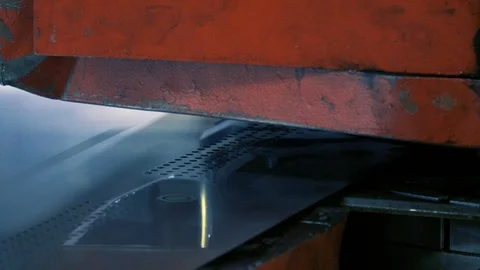 Close-up shot of a CNC coordinate punching press perforates metal sheet Stock Footage 89301146