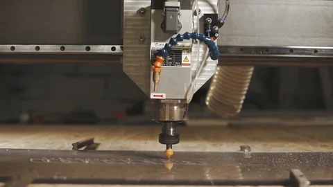 Close up shot of the cnc machine, the man blows off excess dust from the glass Video stock 90177058