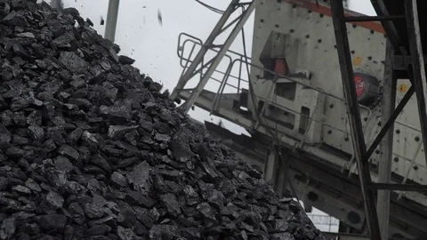 A close-up shot of a coal falling into the coal pile Stock Footage 101505423