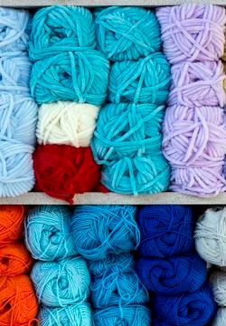 Close up shot of colored wool yarn balls as background Stock Photos