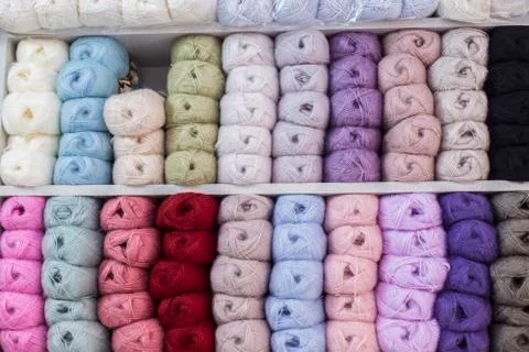 Close up shot of colored wool yarn balls as background Stock Photos