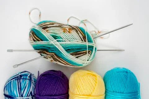 Close up shot of colored wool yarn balls as background Stock Photos