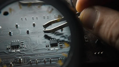 Close-up shot of Computer engineer is fixing computer's motherboard. Stock Footage 121924864