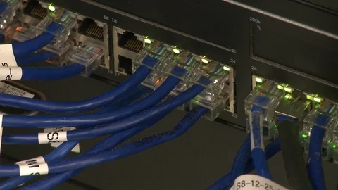 Close up shot of a computer modem as lights flash above connected ports Video stock 96922435