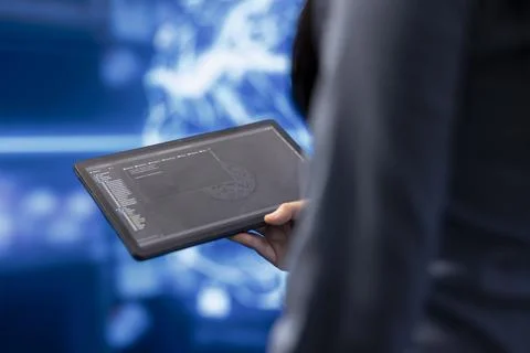 Close up shot of computer scientist using tablet in AI company workplace Foto stock