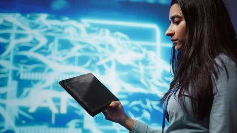 Close up shot of computer scientist using tablet in AI company workspace 写真素材