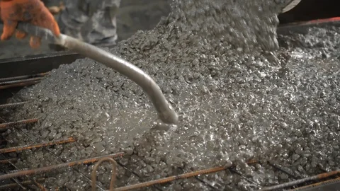 Close-up shot of concrete casting on reinforcing metal bars of a slab Stock Footage 105004612