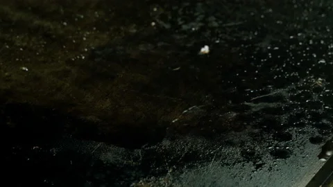 Close-up shot of cook breaking the egg and frying it on a hot oiled grill. 4K 库存影片 97889723