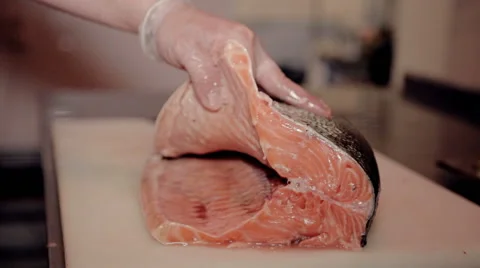 Close up shot the cook cut fresh red fish Stock Footage 65507181