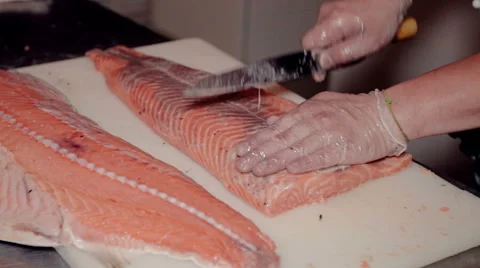 Close up shot the cook cut fresh red fish Stock Footage 65507499