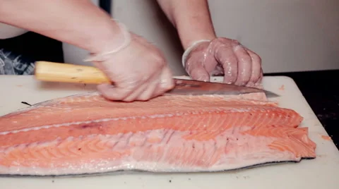 Close up shot the cook cut fresh red fish Stock Footage 65507533