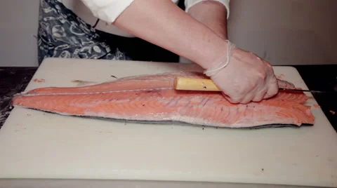 Close up shot the cook cut fresh red fish Stock Footage 65507548