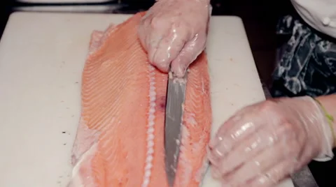 Close up shot the cook cut fresh red fish Stock Footage 65507583