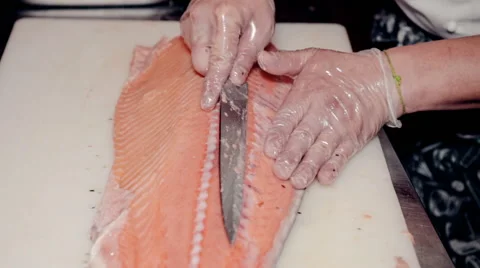 Close up shot the cook cut fresh red fish Stock Footage 65507596