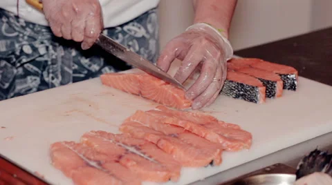 Close up shot the cook cut fresh red fish Stock Footage 65507892