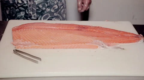 Close up shot the cook remove bones from fresh red fish Stock Footage 65507647