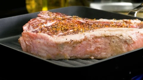Close up shot of cooking steak Stockbeeldmateriaal 102611623