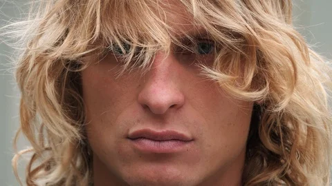 Close up shot of a cool handsome man poprtait. He looks at camera by blue eyes a Stock Footage 119871032